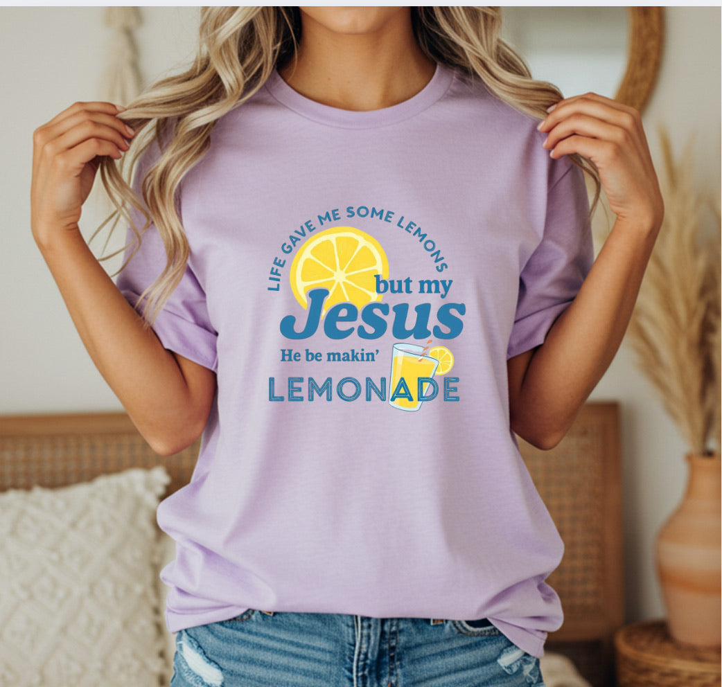 Person wearing a purple t-shirt with a lemon-themed graphic and text.
