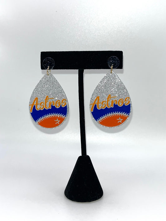 Teardrop-shaped earrings with 'Astros' text on a black stand against a white background