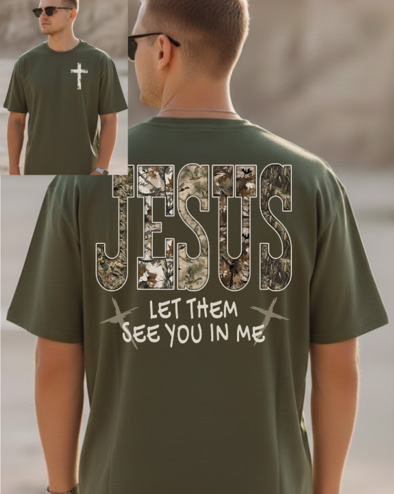 Green t-shirt with 'Jesus' and camouflage design on the back, worn by a person.